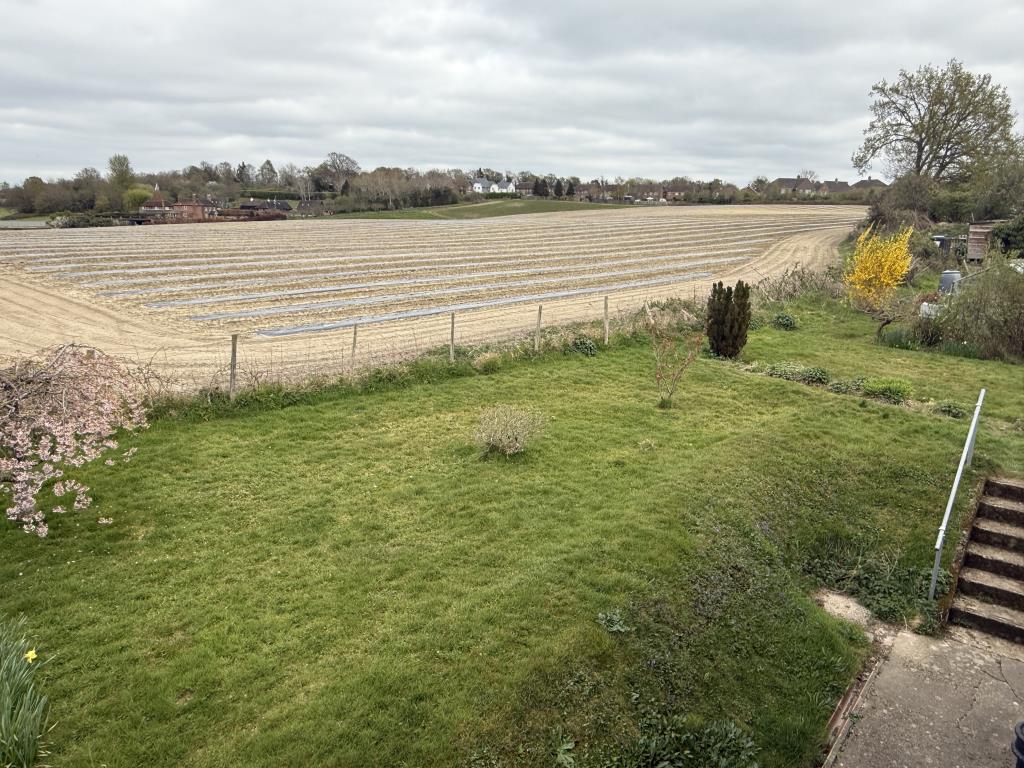 Lot: 155 - THREE-BEDROOM SEMI-DETACHED HOUSE ON OUTSKIRTS OF WEALDEN VILLAGE - Rear view from Bedroom in rural semi in need of modernisation